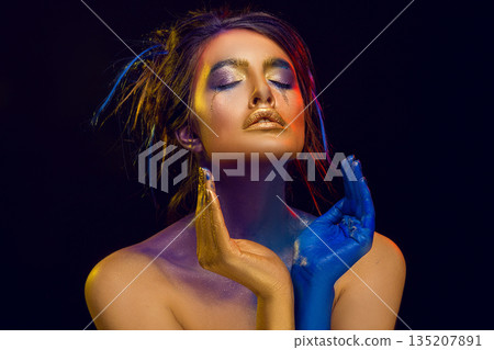 Creative art makeup. Close-up studio portrait of young fashion model Creative art makeup. Close-up studio portrait of young fashion model 135207891