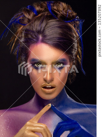Creative art makeup. Close-up studio portrait of young fashion model 135207892