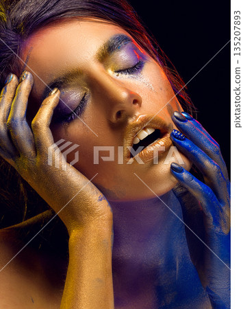 Creative art makeup. Close-up studio portrait of young fashion model Creative art makeup. Close-up studio portrait of young fashion model 135207893