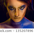 Creative art makeup. Close-up studio portrait of young fashion model 135207896