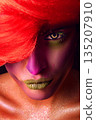 close-up. creative portrait of a girl with bright makeup and red hair 135207910