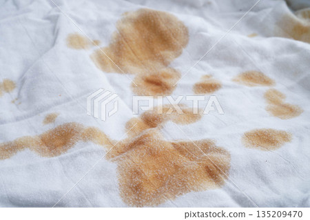 Dirty tomato sauce stain removal or ketchup on cloth accident to wash with washing powder, cleaning housework. Dirty tomato sauce stain removal or ketchup on cloth accident to wash with washing powder, cleaning housework. 135209470