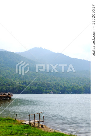 Beautiful landscape rivers and valley mountains and Rustic wooden bridge on riverbank for travel in Thailand Beautiful landscape rivers and valley mountains and Rustic wooden bridge on riverbank for travel in Thailand 135209517