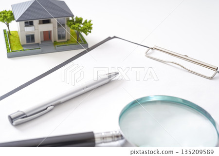 Image of a buyer checking a real estate contract 135209589