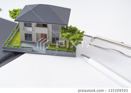 Real estate documents and house model Real estate documents and house model 135209593