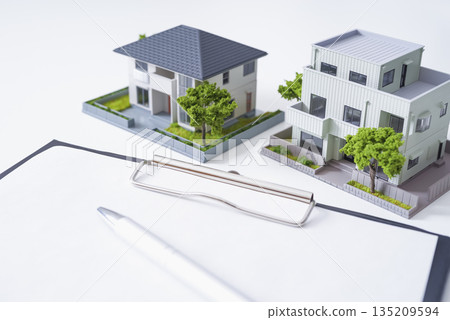 Real estate documents and house model 135209594