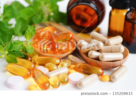 Alternative medicine herbal organic capsule with vitamin E omega 3 fish oil, mineral, drug with herbs leaf natural supplements for healthy good life. Alternative medicine herbal organic capsule with vitamin E omega 3 fish oil, mineral, drug with herbs leaf natural supplements for healthy good life. 135209615
