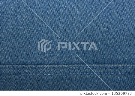 Denim fabric with blue thread seams, denim jacket, denim pants, for background or fabric sample sale. 135209783