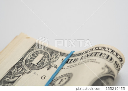 Image of a stack of dollar bills Image of a stack of dollar bills 135210455