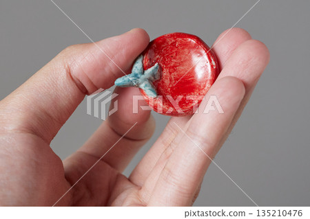 worry stone healing on gray background 135210476