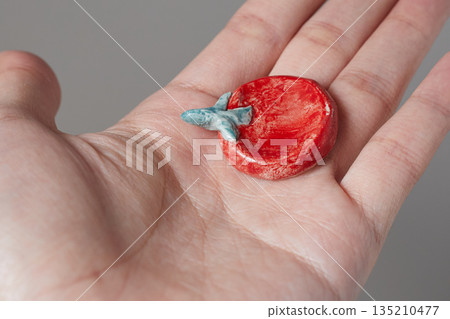 worry stone healing on gray background 135210477