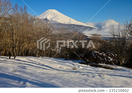 Mount Fuji in the morning as seen from the snow-covered summit of Mount Kurodake in the Ashitaka Mountains Mount Fuji in the morning as seen from the snow-covered summit of Mount Kurodake in the Ashitaka Mountains 135210602