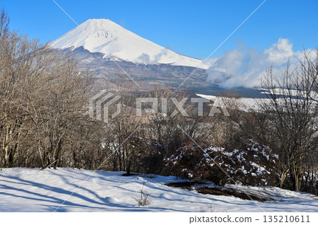Mount Fuji seen from the snow-covered summit of Mount Kurodake in the Ashitaka Mountains Mount Fuji seen from the snow-covered summit of Mount Kurodake in the Ashitaka Mountains 135210611
