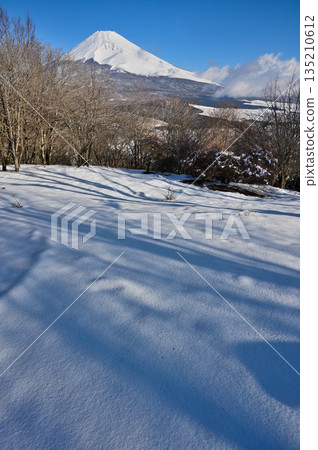 Mount Fuji seen from the snow-covered summit of Mount Kurodake in the Ashitaka Mountains Mount Fuji seen from the snow-covered summit of Mount Kurodake in the Ashitaka Mountains 135210612