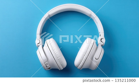 White Wireless Headphones on Blue Background White Wireless Headphones on Blue Background 135211000