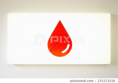 Red Drop Symbol on White Background for Health Awareness 135211016