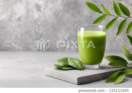 Fresh Green Smoothie in Glass with Spinach Leaves Fresh Green Smoothie in Glass with Spinach Leaves 135211045