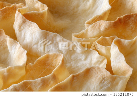 Close-up of Crispy Baked Pastry Layers in Natural Light Close-up of Crispy Baked Pastry Layers in Natural Light 135211075