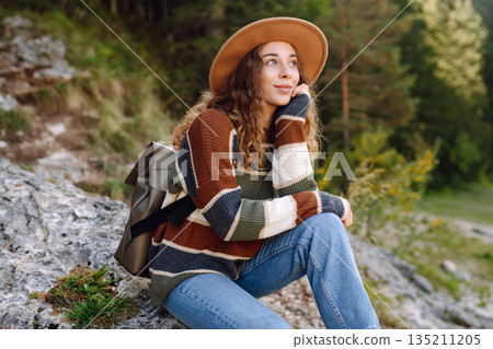 Adventure woman feeling happy among amazing mountains, forest and lake, enjoy the nature landscape Adventure woman feeling happy among amazing mountains, forest and lake, enjoy the nature landscape 135211205