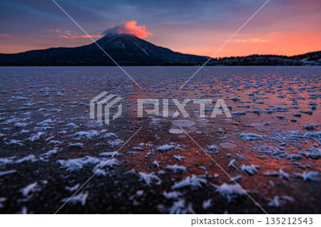 Frost flowers spreading on the ice and the morning glow: a winter scene at Lake Akan 135212543