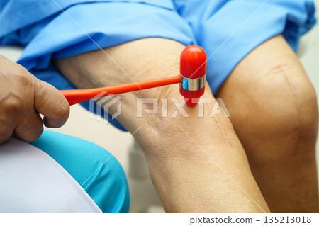 Asian doctor knock on knee reflex nerve for check and treatment senior patient in hospital. Asian doctor knock on knee reflex nerve for check and treatment senior patient in hospital. 135213018