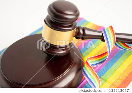 Gavel for judge lawyer on rainbow flag, symbol of LGBT pride month. 135213027