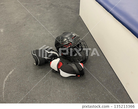 sportswear and skates for a hockey player in the team's locker room 135213366