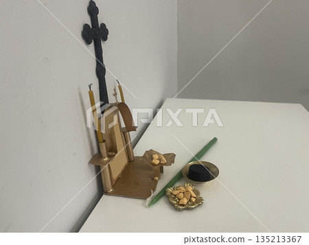 incense with candle near the home altar incense with candle near the home altar 135213367