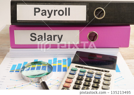 Salary Payroll. binder with graph and calculator in business office. Salary Payroll. binder with graph and calculator in business office. 135213495