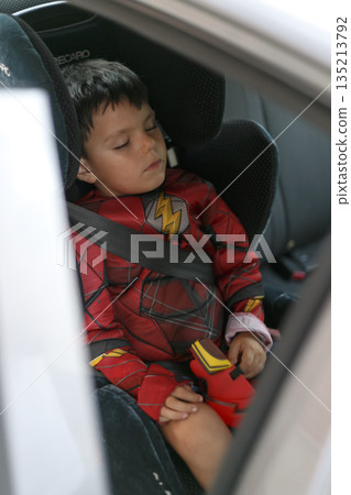 Child sleeping in car 135213792