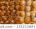 Rows of freshly baked mini muffins 135213843