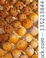 Rows of freshly baked mini muffins 135213844