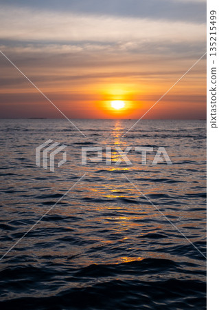 Sunset view of the sea, with colorful sky Sunset view of the sea, with colorful sky 135215499