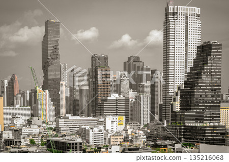 Gazing upon the modern Bangkok skyline, one is immediately struck by the breathtaking vista. The iconic King Power Mahanakhon tower stands as a bold centerpiece. Gazing upon the modern Bangkok skyline, one is immediately struck by the breathtaking vista. The iconic King Power Mahanakhon tower stands as a bold centerpiece. 135216068