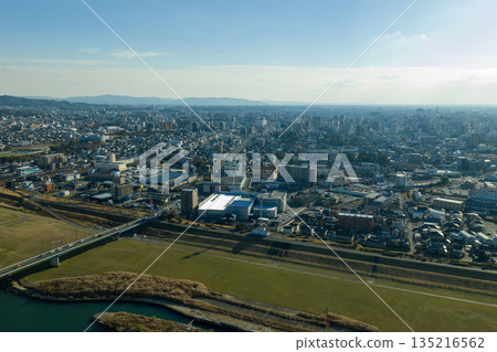Aerial view of the Chikugo River and cityscape of Kurume City, Fukuoka Prefecture, taken by drone. 135216562
