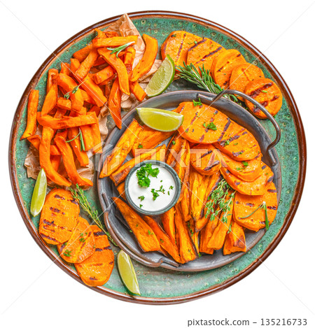 Grilled sweet potato fries and slices with herbs and dipping sauce on ceramic plate isolated on white background, top view Grilled sweet potato fries and slices with herbs and dipping sauce on ceramic plate isolated on white background, top view 135216733