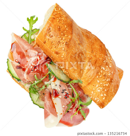 Fresh croissant sandwich with prosciutto, mozzarella, cucumber and arugula isolated on white background Fresh croissant sandwich with prosciutto, mozzarella, cucumber and arugula isolated on white background 135216734