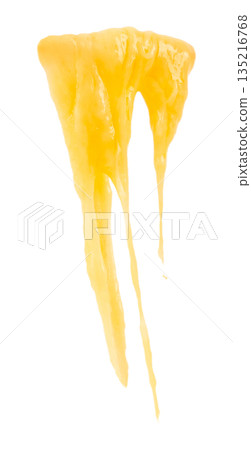 Melting yellow cheese drip isolated on white background with long flowing texture Melting yellow cheese drip isolated on white background with long flowing texture 135216768