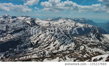 Rocky snow mountains before sunset aerial Rocky snow mountains before sunset aerial 135217669