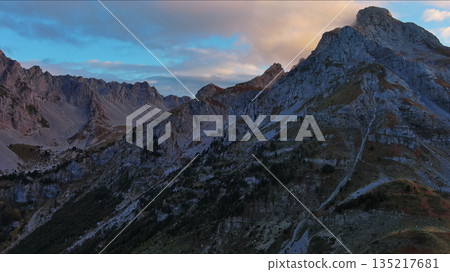 Aerial view of amazing rocky mountains at sunset Aerial view of amazing rocky mountains at sunset 135217681