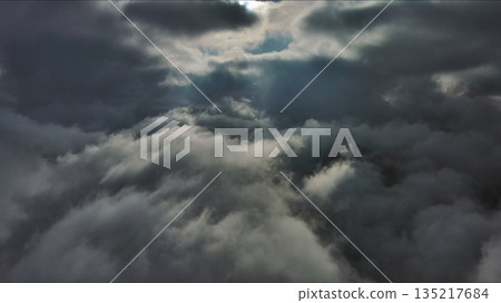 Aerial high view of dramatic clouds and sun Aerial high view of dramatic clouds and sun 135217684