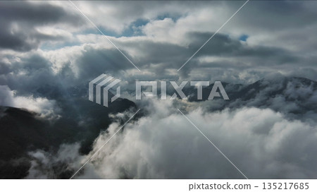 Aerial high view of dramatic clouds and sun Aerial high view of dramatic clouds and sun 135217685