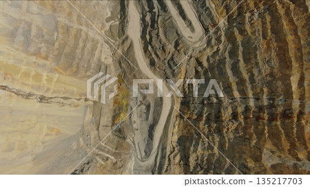 Aerial of open mine and heavy mining equipment Aerial of open mine and heavy mining equipment 135217703