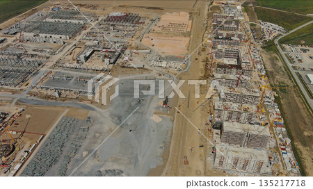 Industrial construction site with construction equipment and materials Industrial construction site with construction equipment and materials 135217718