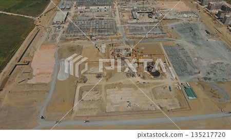Industrial construction site with construction equipment and materials 135217720