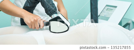 Female spa treatment with advanced laser equipment for skin health and body 135217855