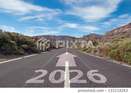Wide open road under a blue cloudy sky with 2026 on road surface Wide open road under a blue cloudy sky with 2026 on road surface 135218263