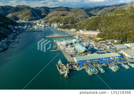 Aerial view of the townscape of Hinase, Okayama Prefecture, surrounded by a charming fishing port and mountains in winter 135218398