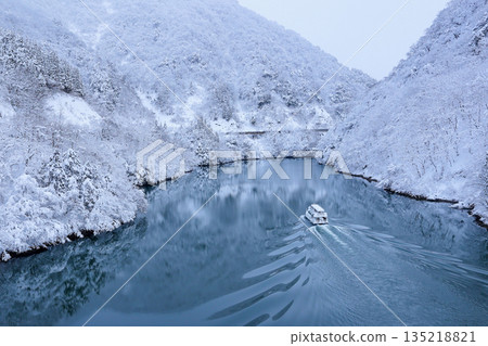 A sightseeing boat sailing through the Yukinosho River Gorge 135218821