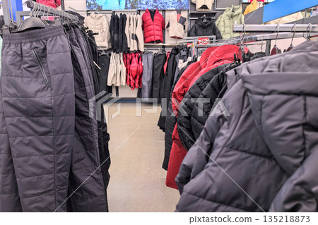 Vibrant clothing display inviting shoppers to explore warm winter options Vibrant clothing display inviting shoppers to explore warm winter options 135218873